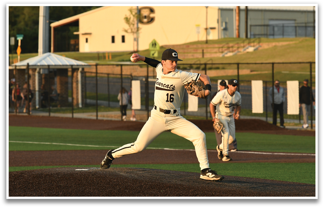A baseball player in a white uniform is pitching a ball on a field. AI generated content