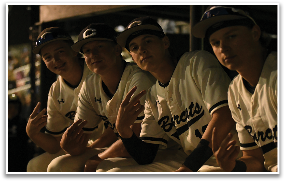 Four baseball players pose for a picture. AI generated content