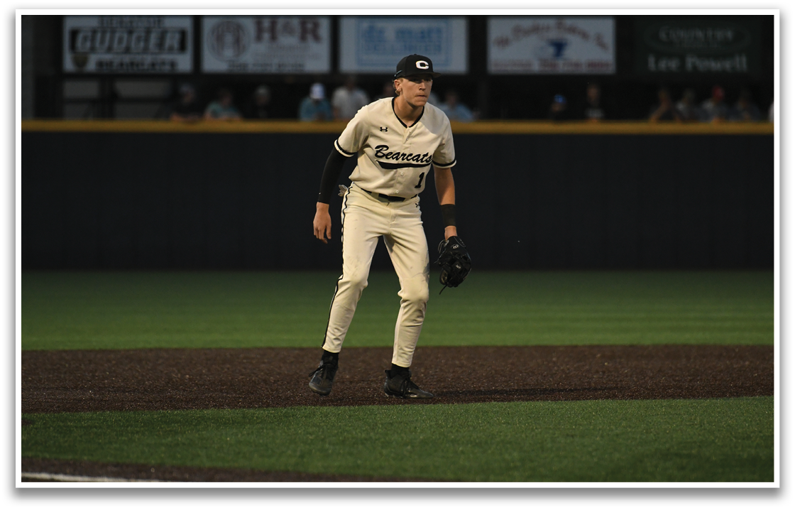 A baseball player is standing on the field, wearing a baseball glove and holding a baseball bat. AI generated content