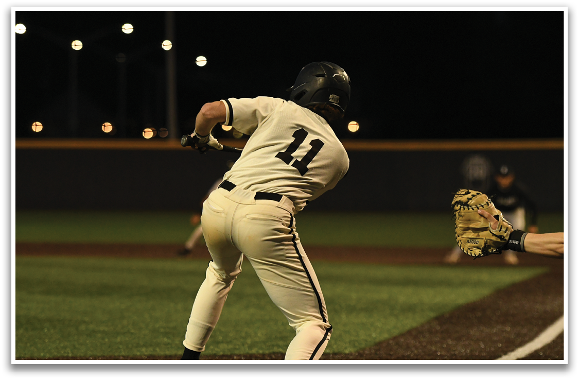 A baseball player is swinging a bat, attempting to hit a ball. The player is wearing a baseball glove, ready to catch the ball if it comes their way. AI generated content