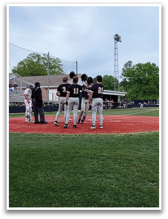 A group of baseball players on a field, some of them wearing number 11 jerseys. AI generated content