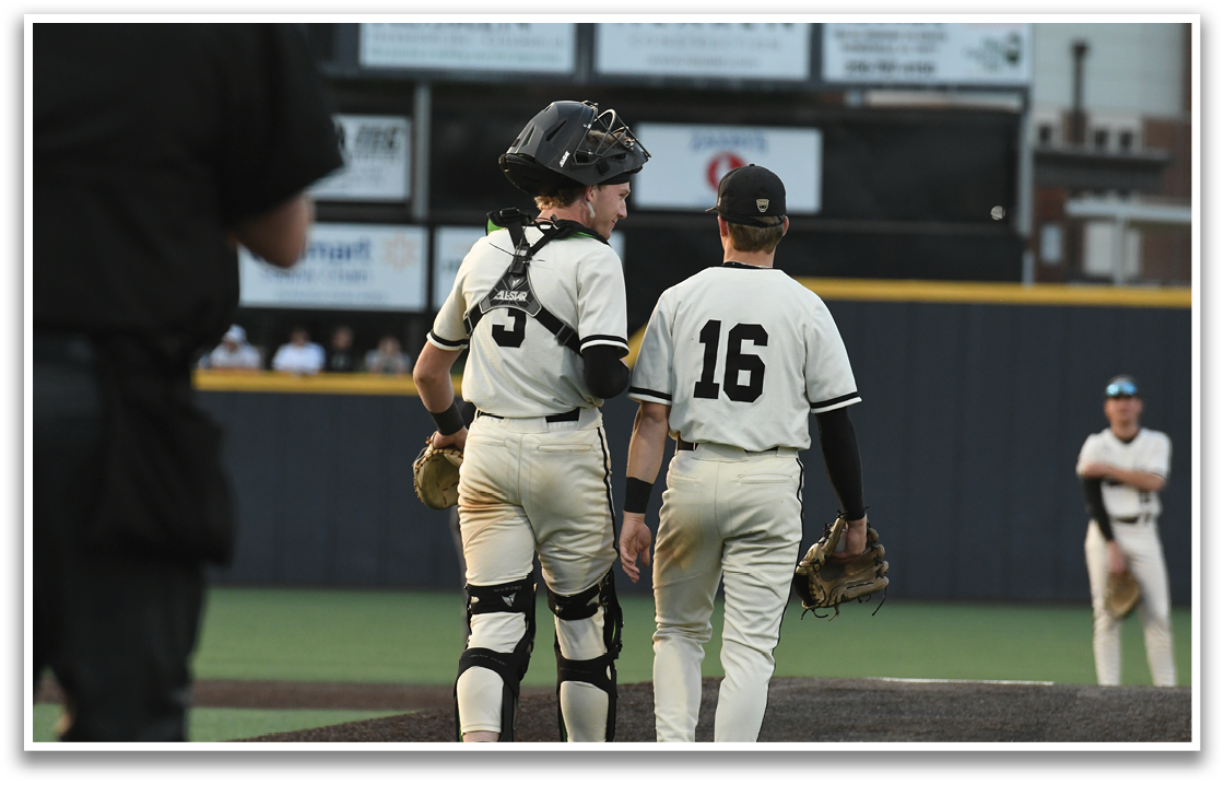 Two baseball players wearing number 16 and 3 are talking to each other on the field. AI generated content