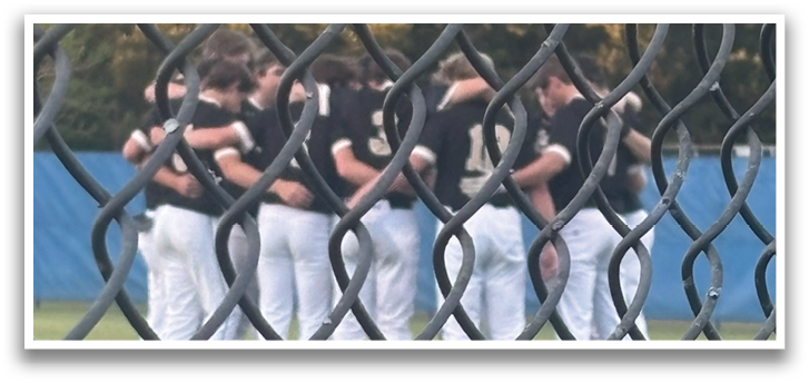 A group of baseball players huddled together on the field. AI generated content