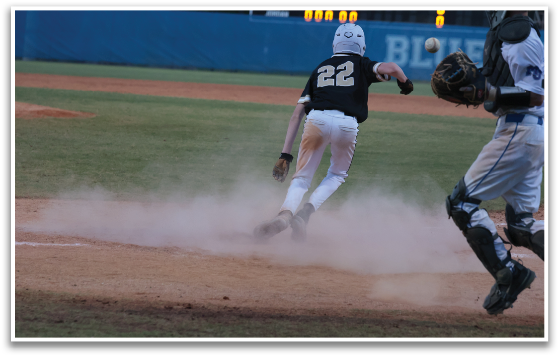 A baseball player slides into home plate while the catcher tries to tag him out. AI generated content