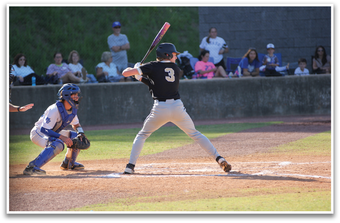 A baseball player is swinging a bat at a ball during a game. AI generated content