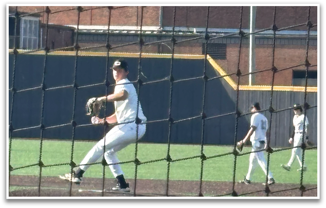 A baseball player in a white uniform is pitching a ball on a field. AI generated content