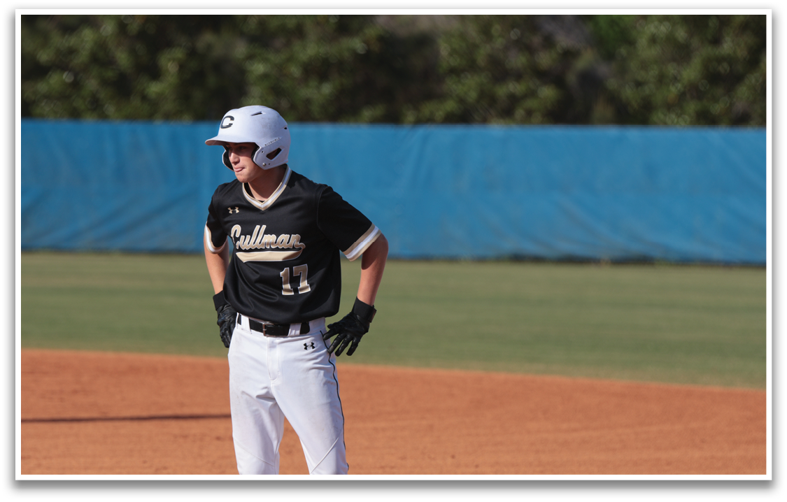 A baseball player wearing a black jersey and white pants is standing on a field. AI generated content