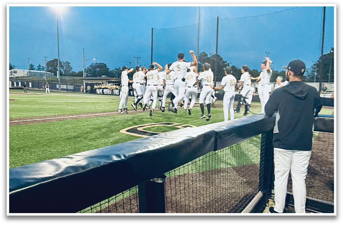 A group of baseball players are standing on the field, celebrating their victory. AI generated content