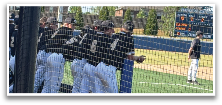 A man is sitting in a chair, watching a baseball game. AI generated content