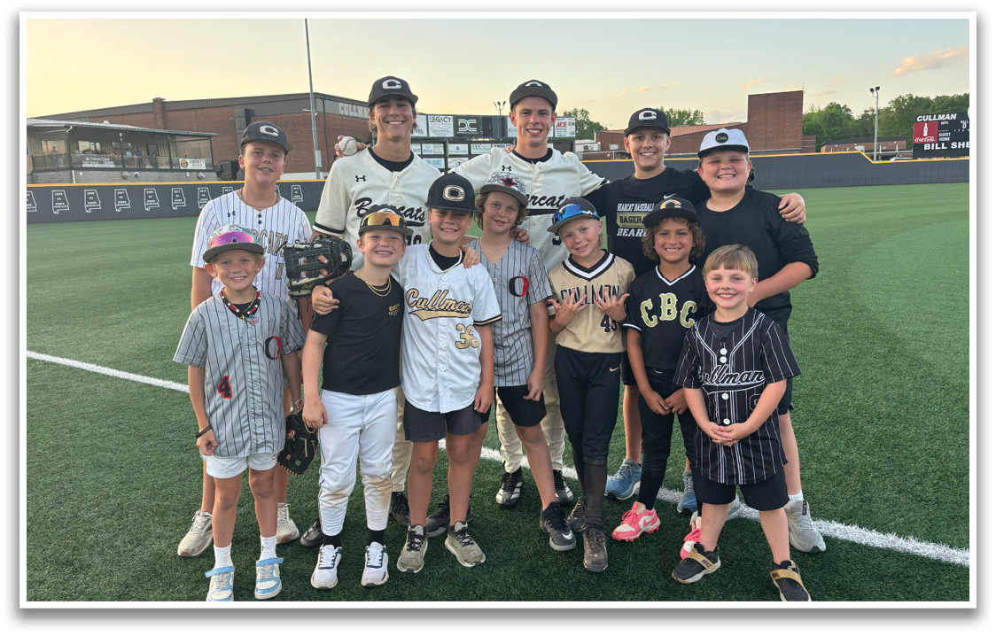 A group of children and young boys posing for a picture on a baseball field. AI generated content