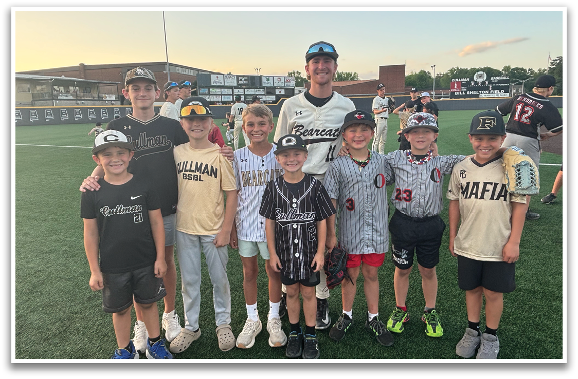 A group of young boys wearing baseball uniforms pose for a picture. AI generated content