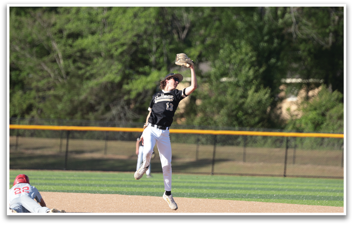 A baseball player catches a ball in the air. AI generated content