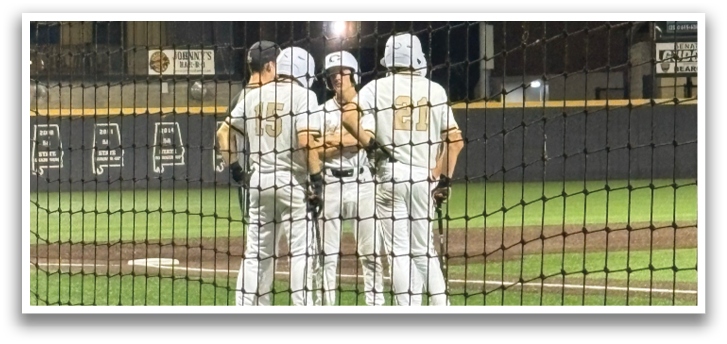 A group of baseball players huddled together on the field. AI generated content