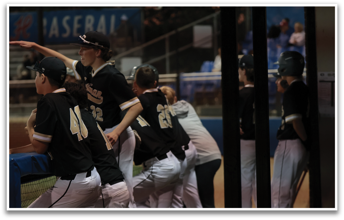 A group of baseball players huddle together on the field. AI generated content