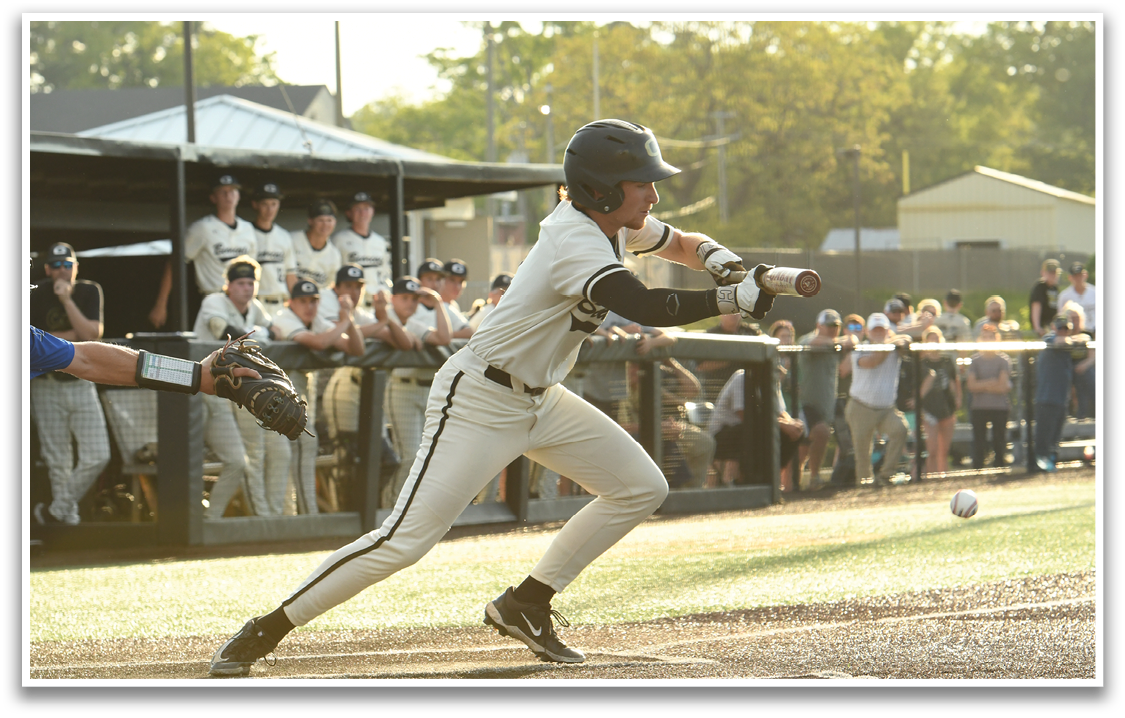 A baseball player in a white uniform is swinging a bat, attempting to hit a ball. AI generated content