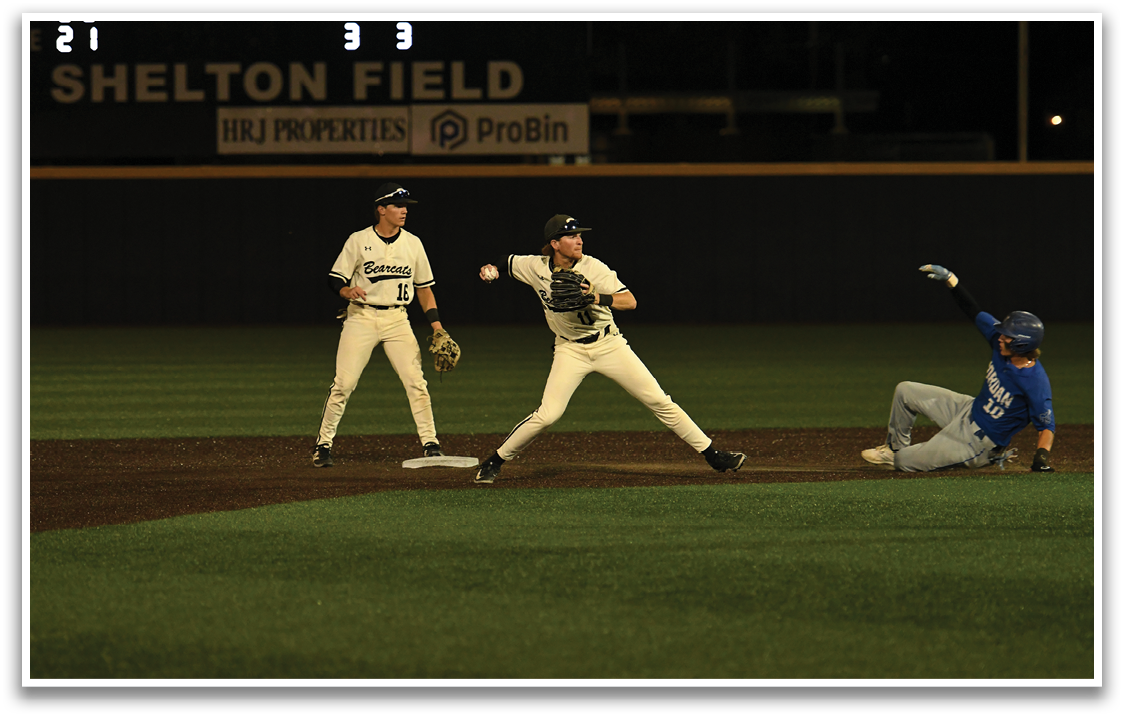 A baseball game is taking place with three players on the field. One player is throwing a ball while another player is sliding into a base. The third player is standing nearby, ready to catch the ball. AI generated content