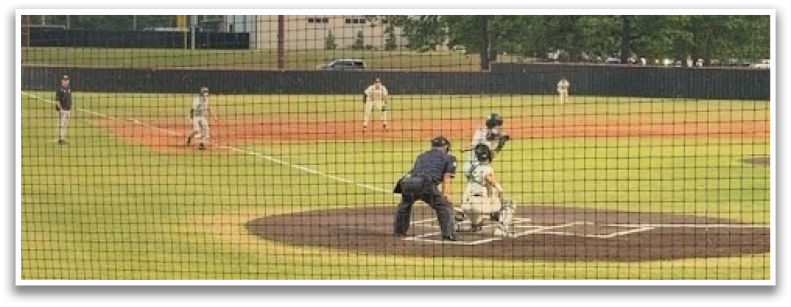 A baseball game is taking place on a field with a batter, catcher, and umpire. The batter is holding a baseball bat, ready to swing at the incoming pitch. AI generated content
