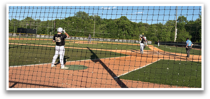 A baseball game is in progress with a batter, catcher, and umpire on the field. The batter is holding a baseball bat, ready to swing. AI generated content