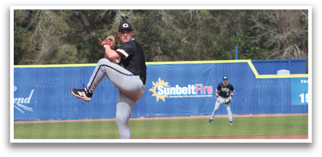 A baseball player in a black shirt and grey pants is pitching a ball on a field. AI generated content