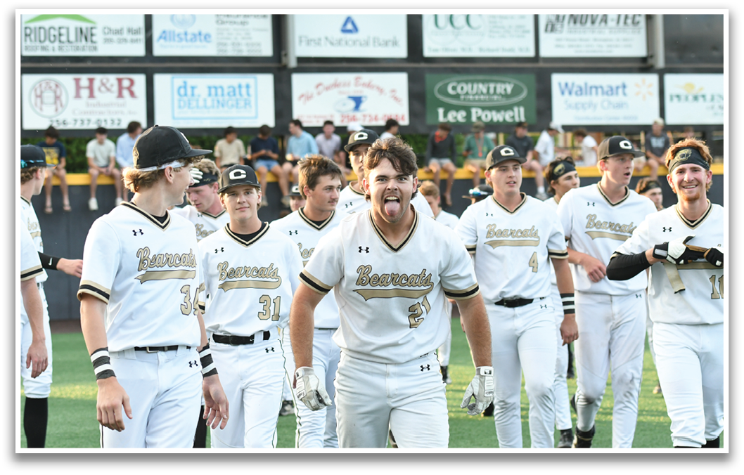 A group of baseball players wearing white uniforms. Description generated by AI