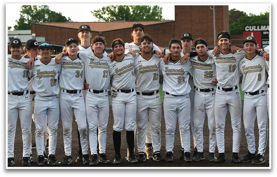 Baseball players in white uniforms. Description generated by AI