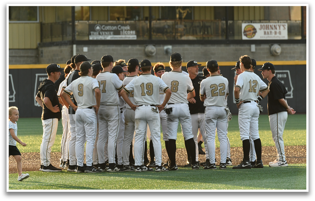 A group of baseball players standing on a field. Description generated by AI
