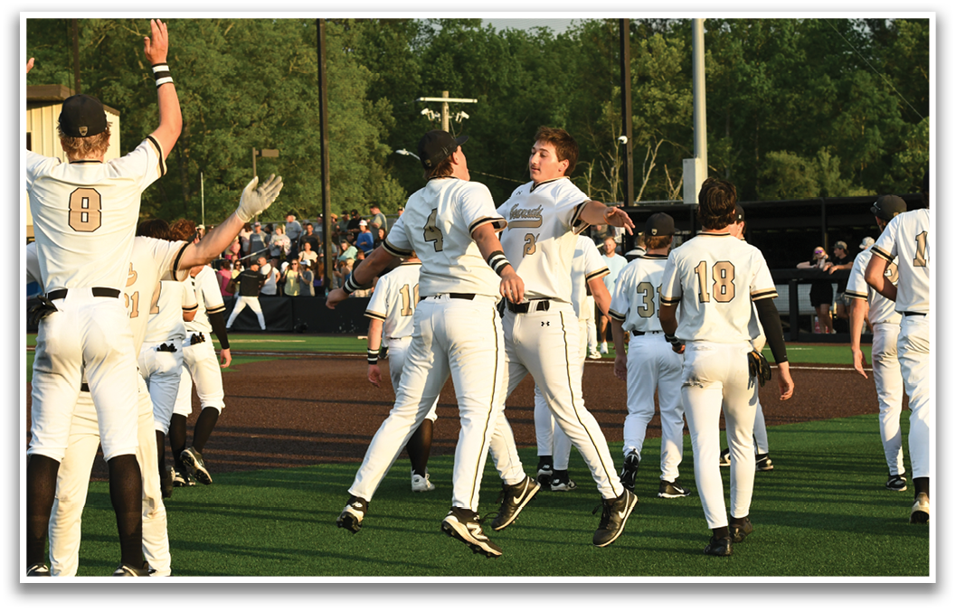A group of baseball players celebrating a win. Description generated by AI