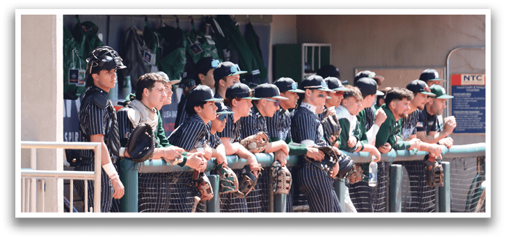 Baseball players in a dugout. Description generated by AI
