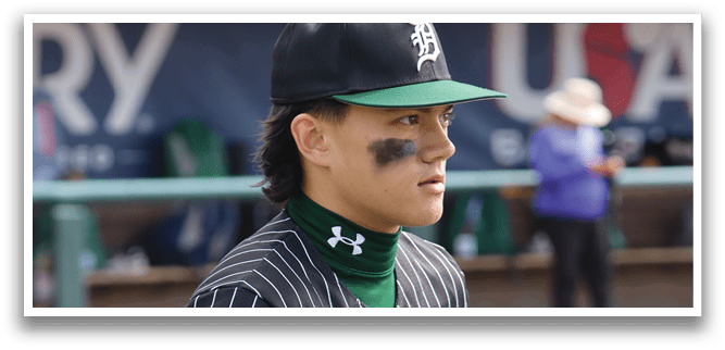 A baseball player wearing a green and black striped shirt. Description generated by AI