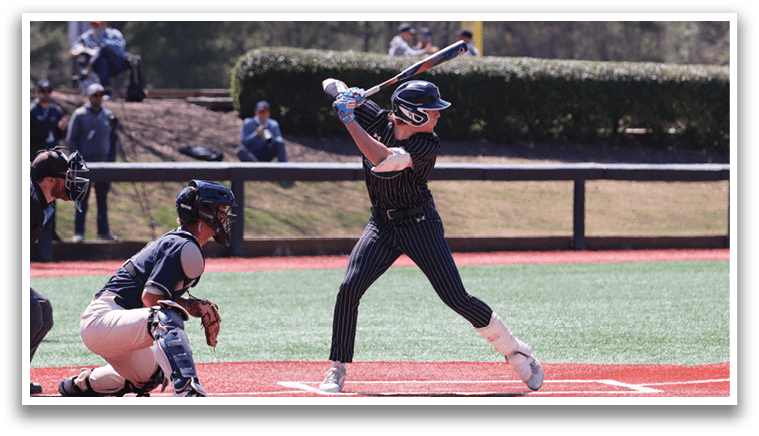 A baseball player is swinging a bat at a ball. Description generated by AI