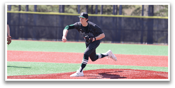 A baseball player in a black and white uniform is pitching a ball. Description generated by AI