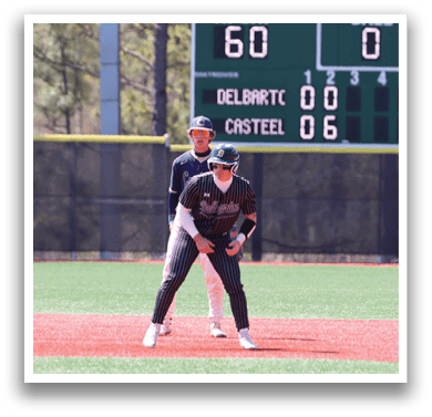 A baseball player is standing on the field with a bat. Description generated by AI