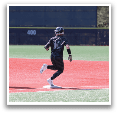 A baseball player running on the field. Description generated by AI