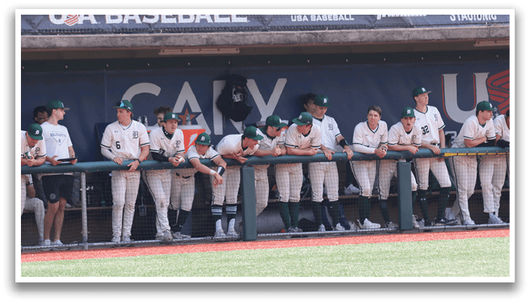 Baseball players sitting on bench. Description generated by AI