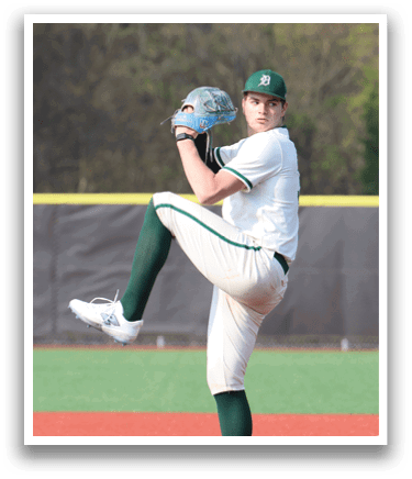 A baseball player in a white uniform is pitching a ball. Description generated by AI