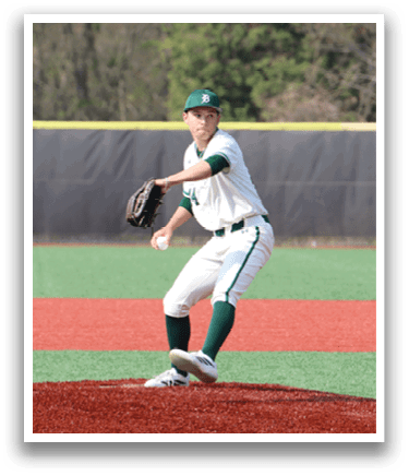 A baseball player in a white and green uniform is pitching a ball. Description generated by AI