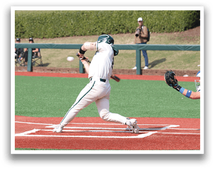 A baseball player is swinging a bat at a ball. Description generated by AI