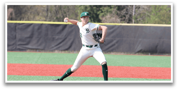 A baseball player in a white uniform is pitching a ball. Description generated by AI