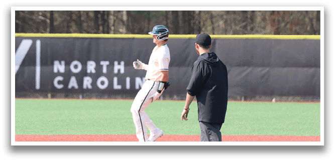 A baseball player is standing on the field. Description generated by AI