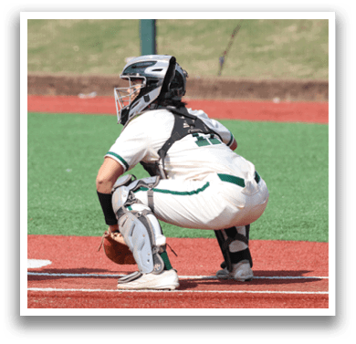 A baseball player is at bat, ready to swing. Description generated by AI