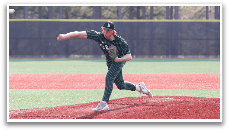 A baseball player in a green shirt and green pants is pitching a ball. Description generated by AI