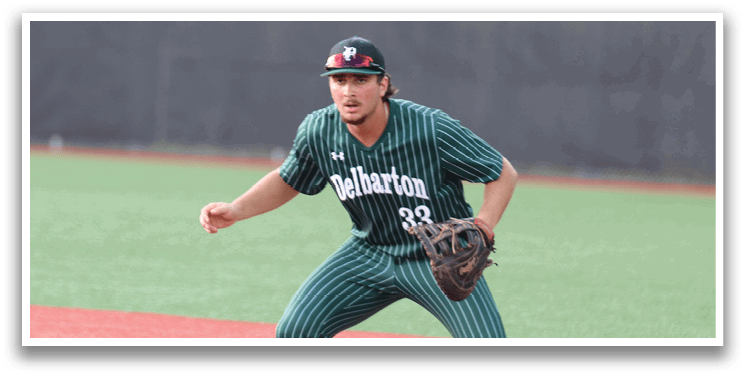 A baseball player wearing a green and white uniform. Description generated by AI