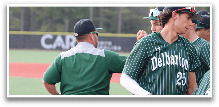 A baseball player wearing a green and white uniform. Description generated by AI
