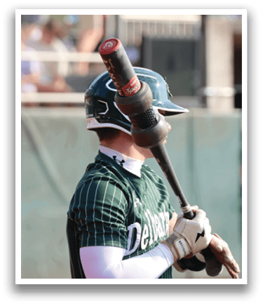 A baseball player holding a bat. Description generated by AI