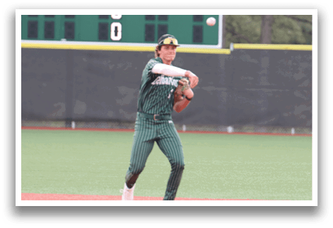 A baseball player wearing a green and white uniform is throwing a ball. Description generated by AI
