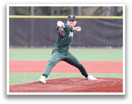 A baseball player in a green and black uniform is pitching a ball. Description generated by AI
