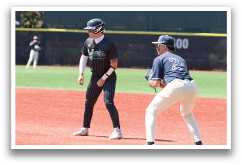 A baseball player wearing a black and white striped shirt. Description generated by AI