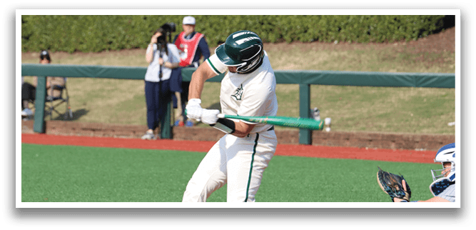 A baseball player is swinging a bat at a ball. Description generated by AI