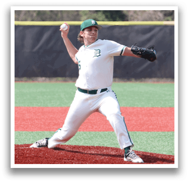 A baseball player in a white uniform is pitching a ball. Description generated by AI