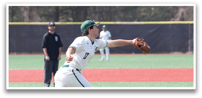 A baseball player in a white and green uniform is throwing a ball. Description generated by AI